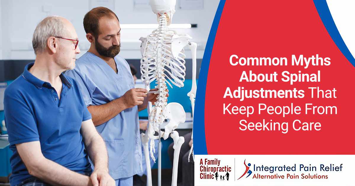 Doctor at A Family Chiropractic Clinic explaining the spinal cord to a patient, illustrating common myths about spinal adjustments that prevent people from seeking care.